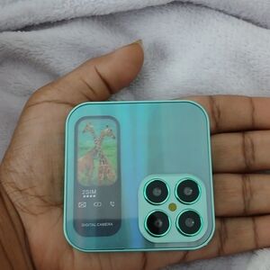 Compact Teal Digital Camera with Quad Lens
